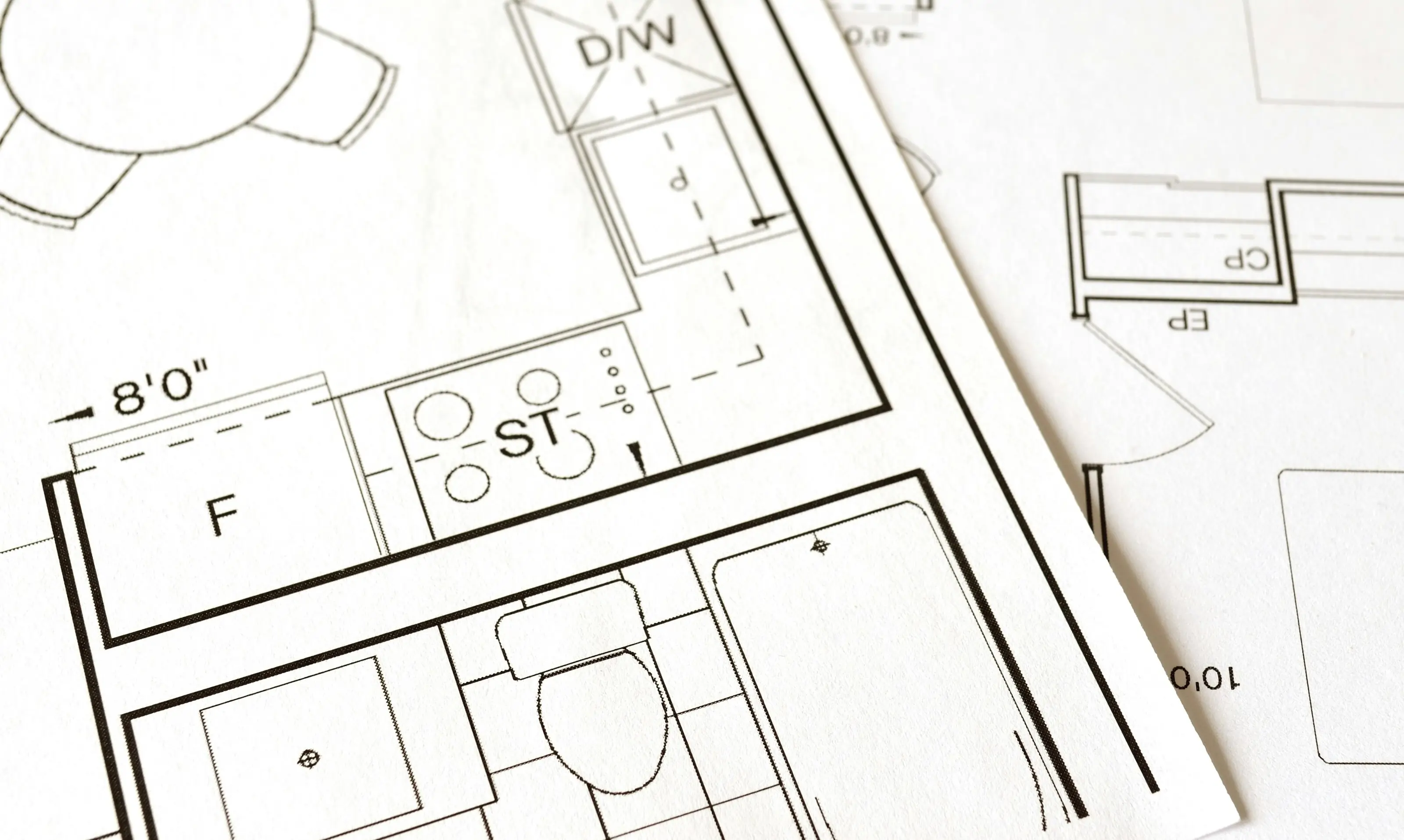 Landscape designer working on detailed CAD drawing of outdoor entertainment area