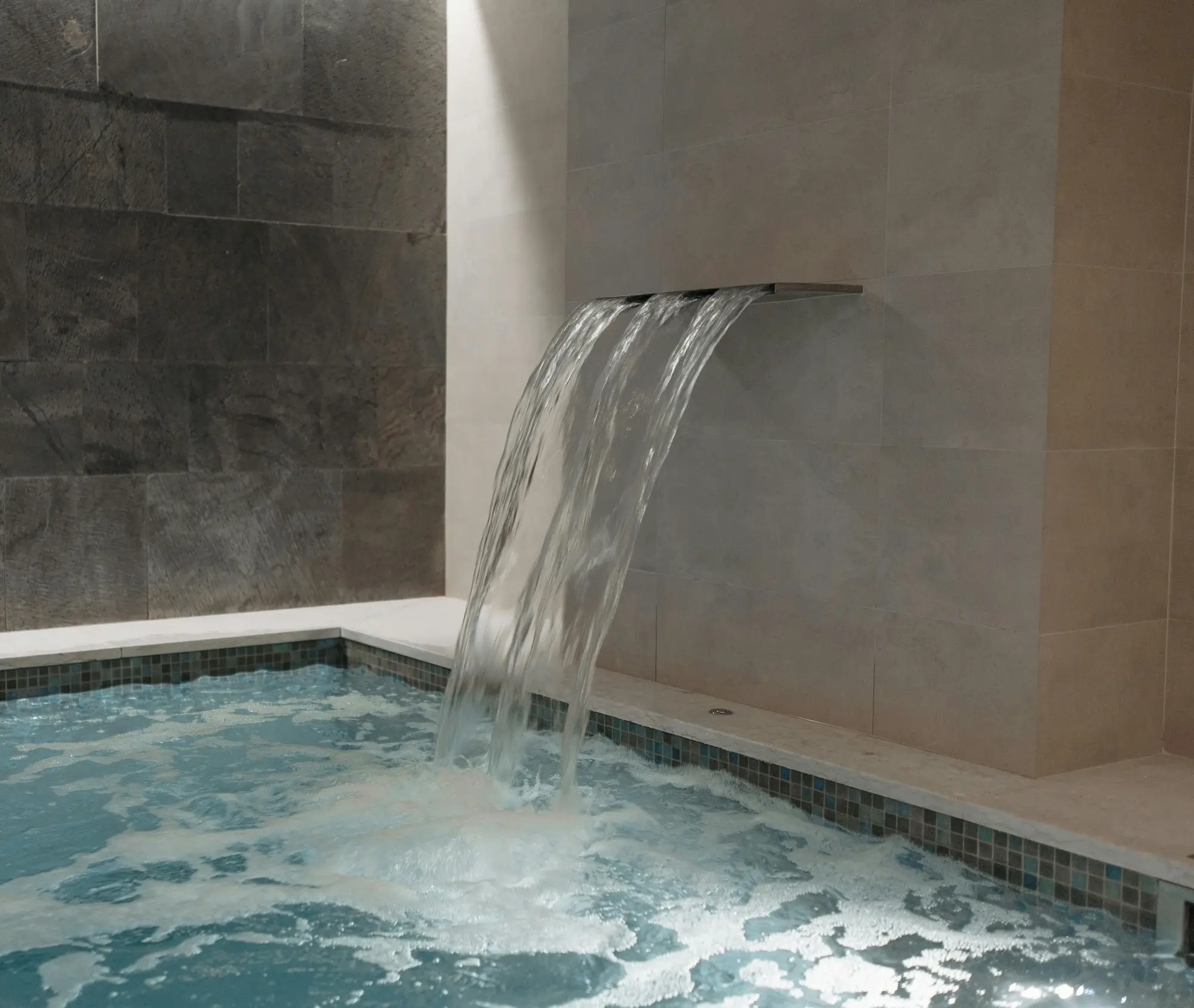 Construction of natural stone water feature with integrated lighting
